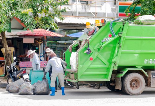 Rubbish being cleared from a residential garden