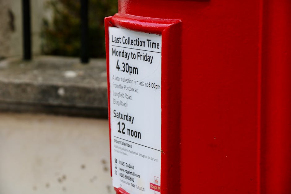 Close-up of a digital parking meter with a backlit screen displaying the message 'FREE PARKING. NO PAYMENT REQUIRED.' in black text on a white background. The meter has a rectangular shape with a whit